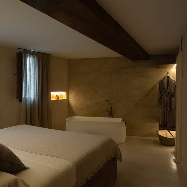 Habitación Hotel Villa Raiz den de se pueden ver todos los textiles suministrados